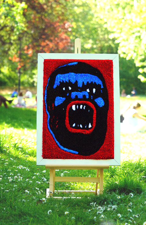 hand-tufted wool rug from Funky Fluffs. Featuring a fierce face in deep black, electric blue, and blood-red tones, this piece isn’t just decor—it’s a full-on statement. Whether you hang it like art or lay it underfoot, this rug screams individuality